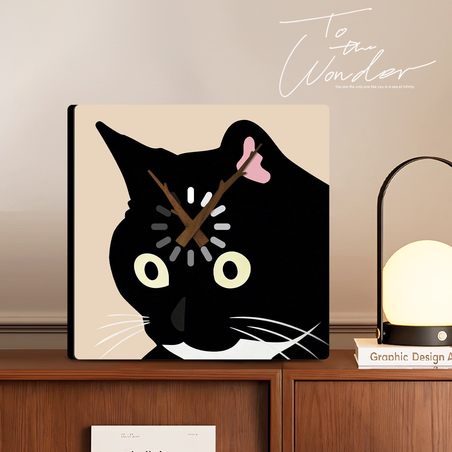 Black cat clock displayed in a cosy home