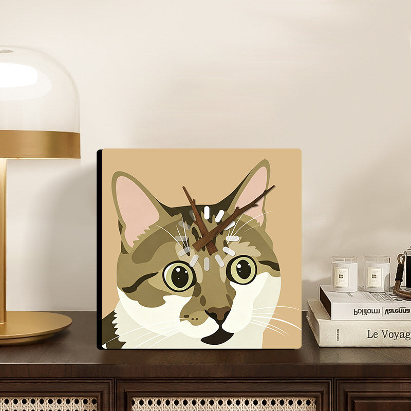 Tabby cat clock styled beside a lamp